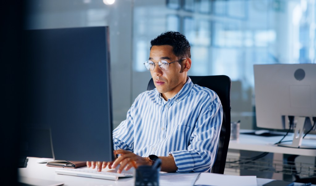 A TSP employee providing IT outsourcing services