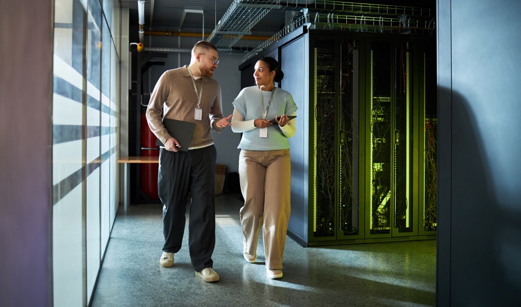 Male and female TSP employees providing IT talent in a data center