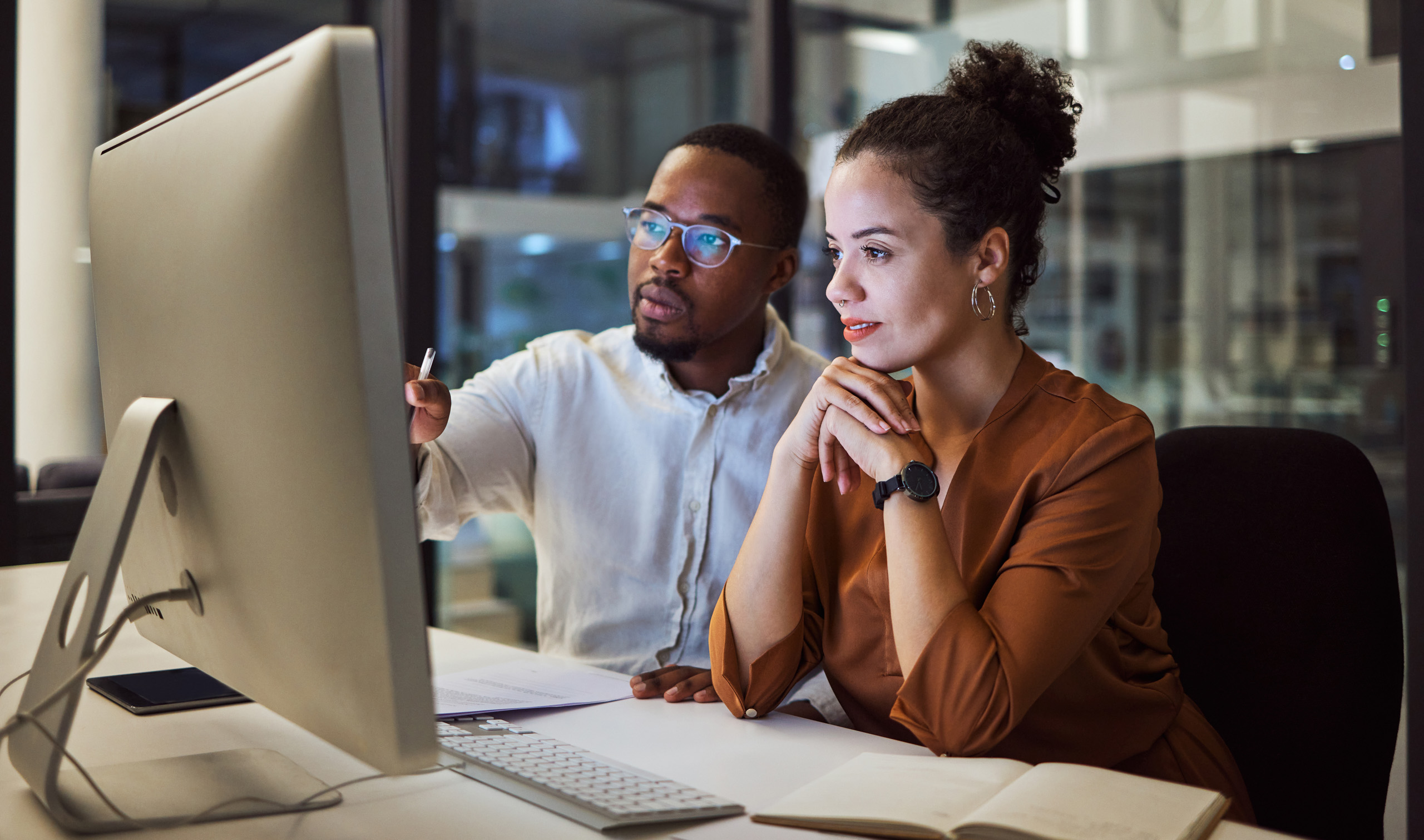 Two people evaluating contract-to-hire IT recruitment candidates
