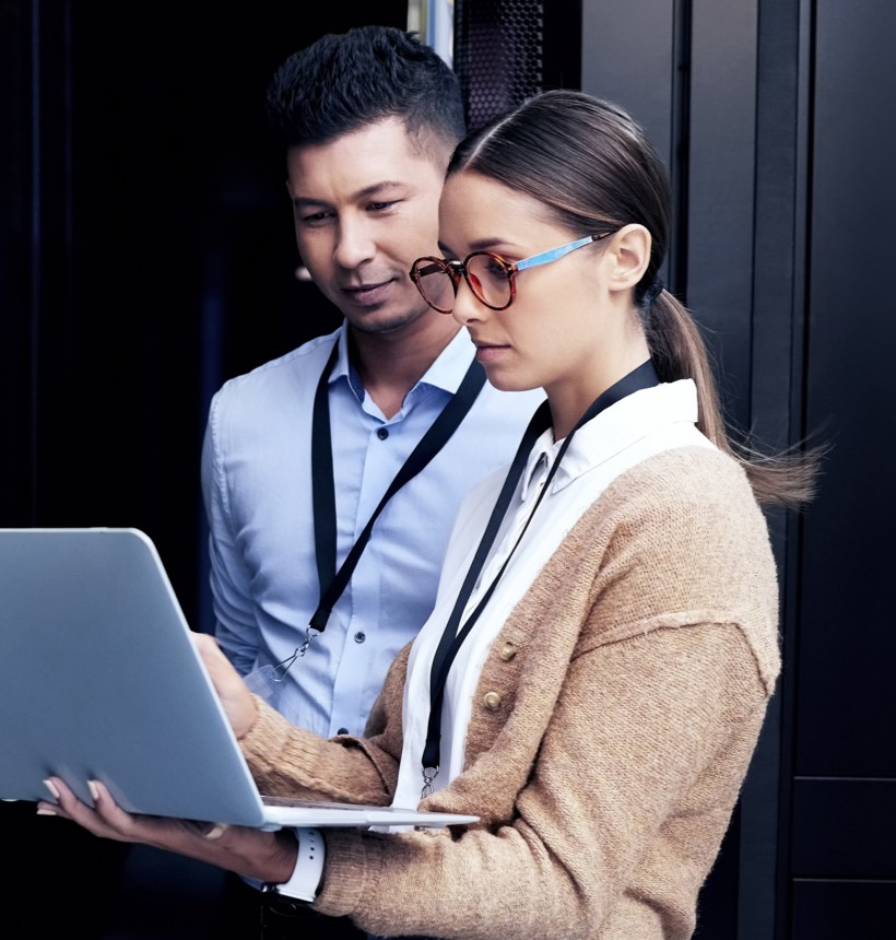 Two professionals searching for IT experts to recruit